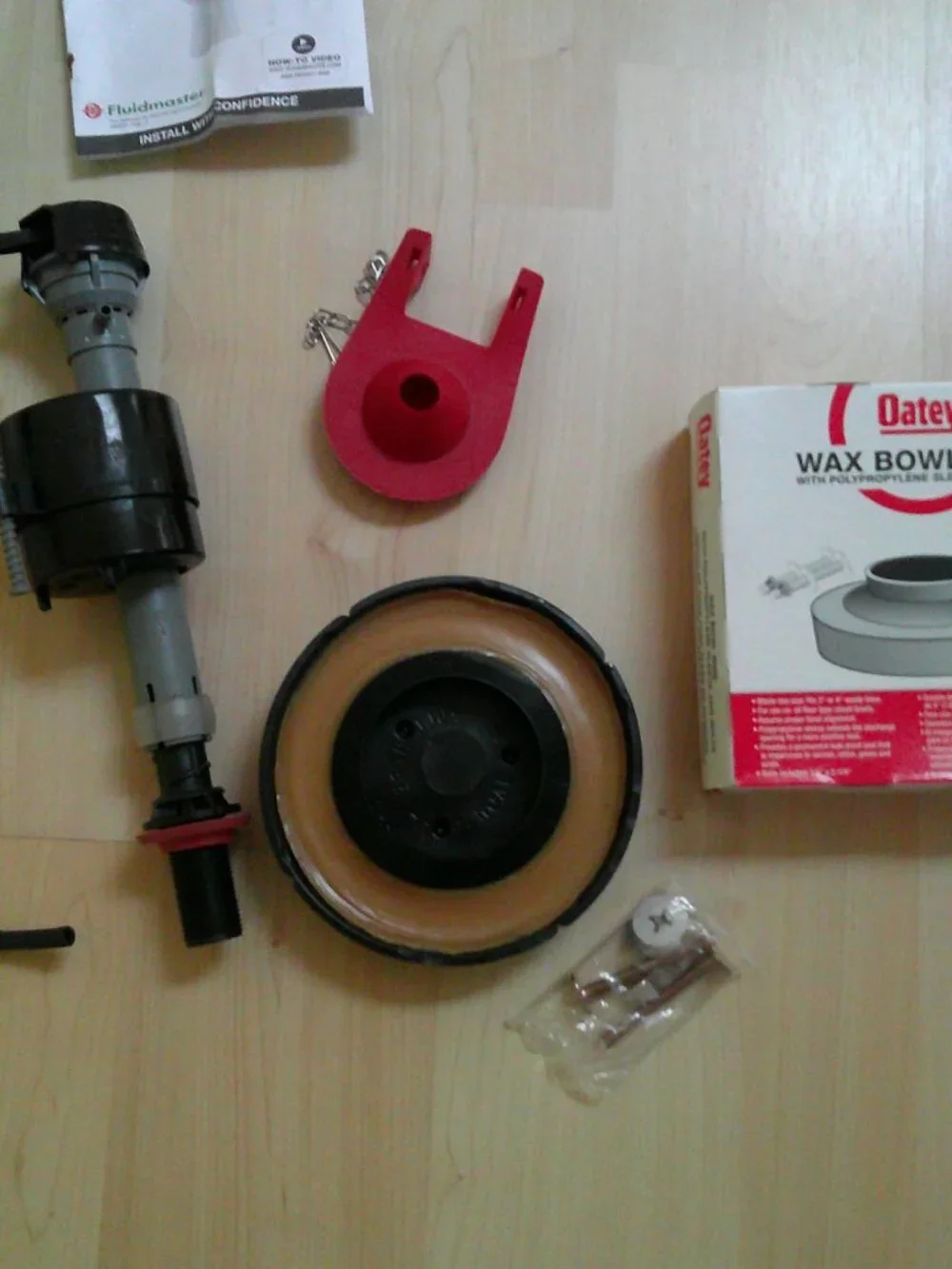Fluidmaster Toilet Repair items flush valve, Oatey wax ring, & 2-Korky flappers.